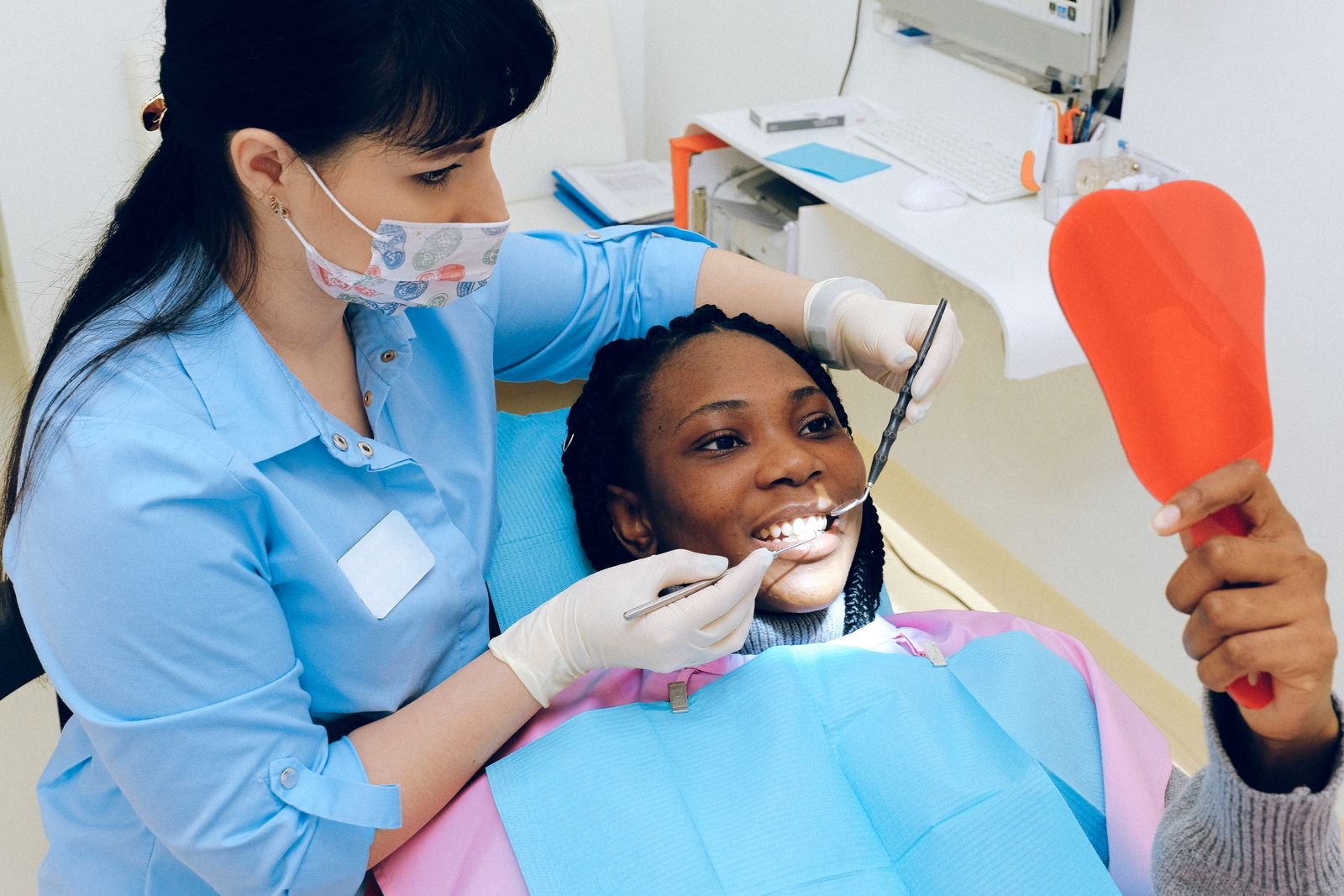 Patient admiring smile after check-up
